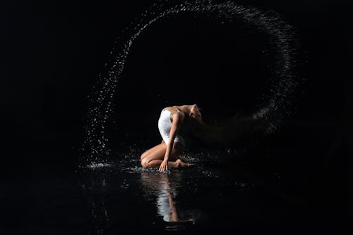 Performer Splashing Water with Her Hair