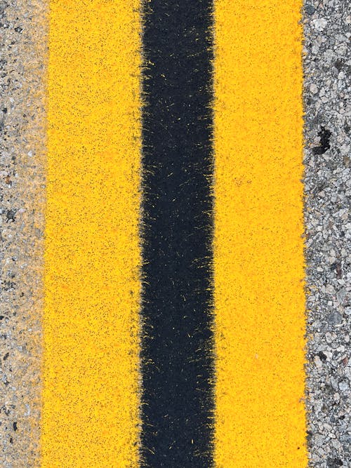 Close up of Yellow Lines on a Road 