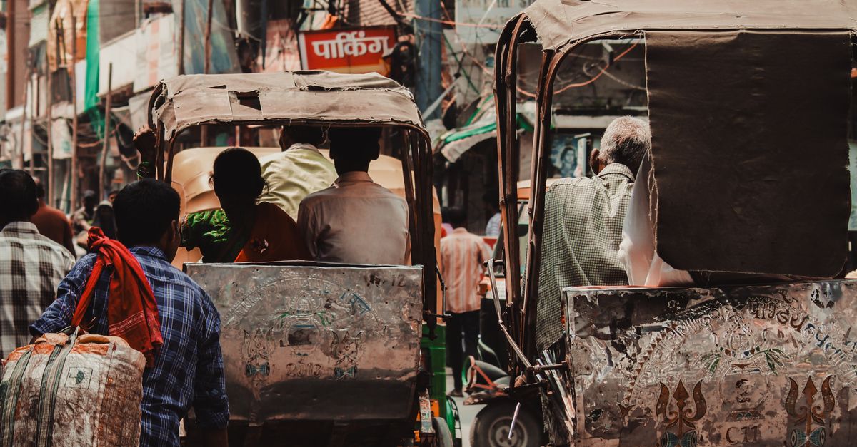 Varanasi Rickshaws Rickshaws and Pedestrians on the Street of Varanasi India · Free Stock ...