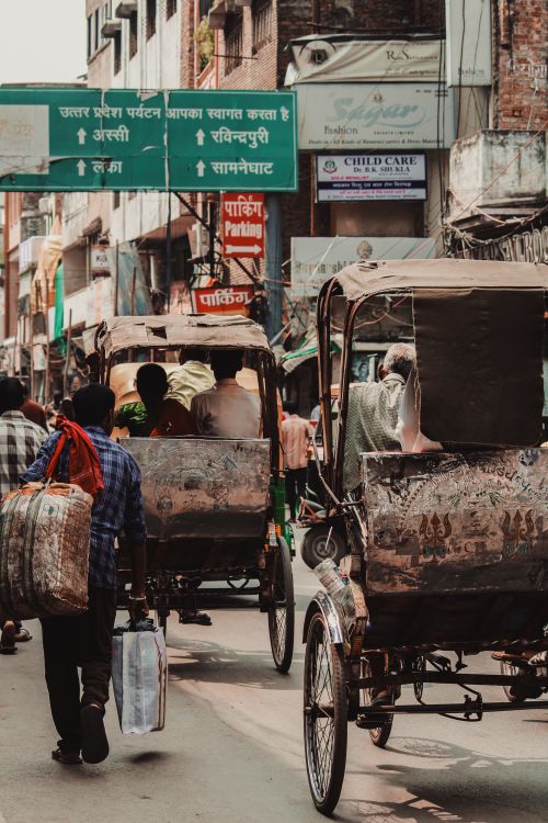 Varanasi Rickshaws Rickshaws and Pedestrians on the Street of Varanasi India · Free Stock ...