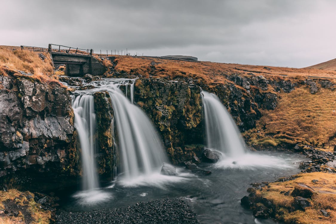 Water Falls Under Gray Cloudy Sky