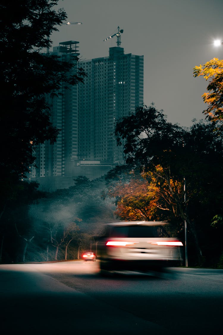 Cars On City Street In Autumn At Night