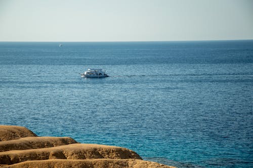 Barren Shore and a Ferry on the Sea