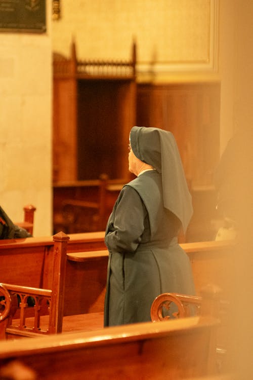 Nun Praying in Church