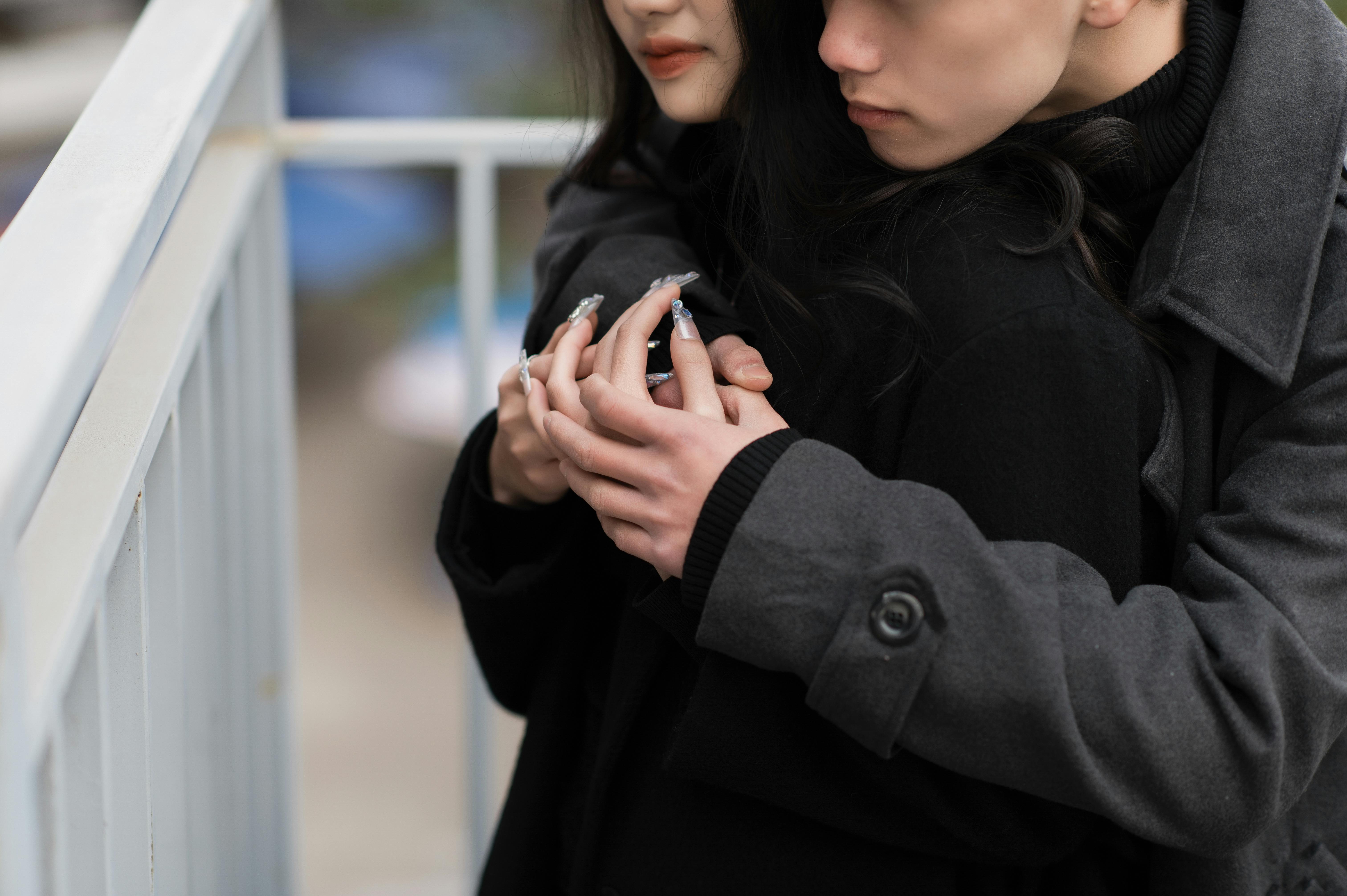 Couple Wearing Jackets Hugging · Free Stock Photo