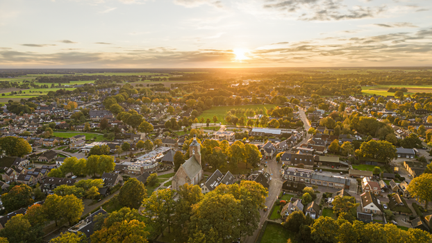 A stunning drone shot of Ruinen village at sunset showcasing a picturesque landscape.