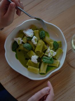 A delectable plate of rigatoni pasta with spinach and ricotta, perfect for food lovers.