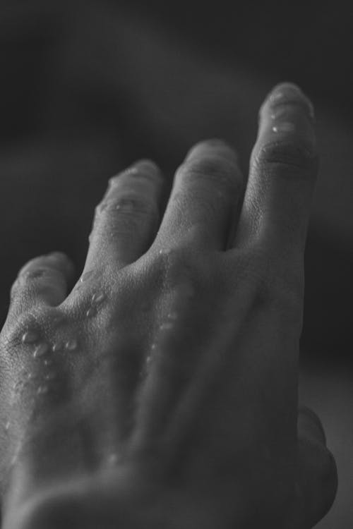 Water Drops on Man Skin