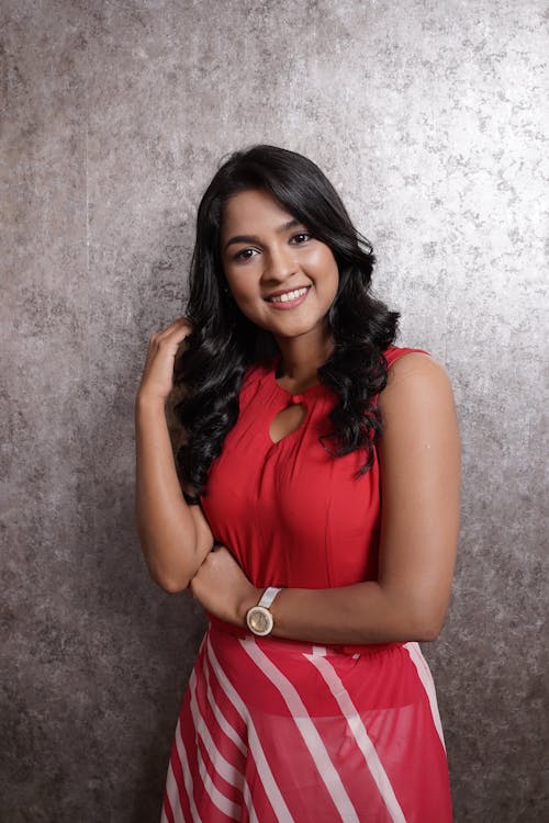 Portrait of a Pretty Brunette Wearing a Red Dress