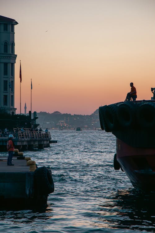 People at a City Harbor at Dusk