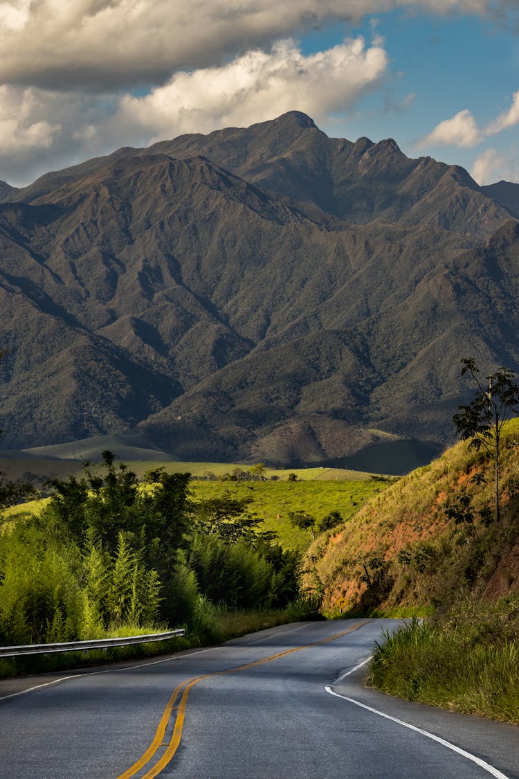 Empty Road With Mountain Behind