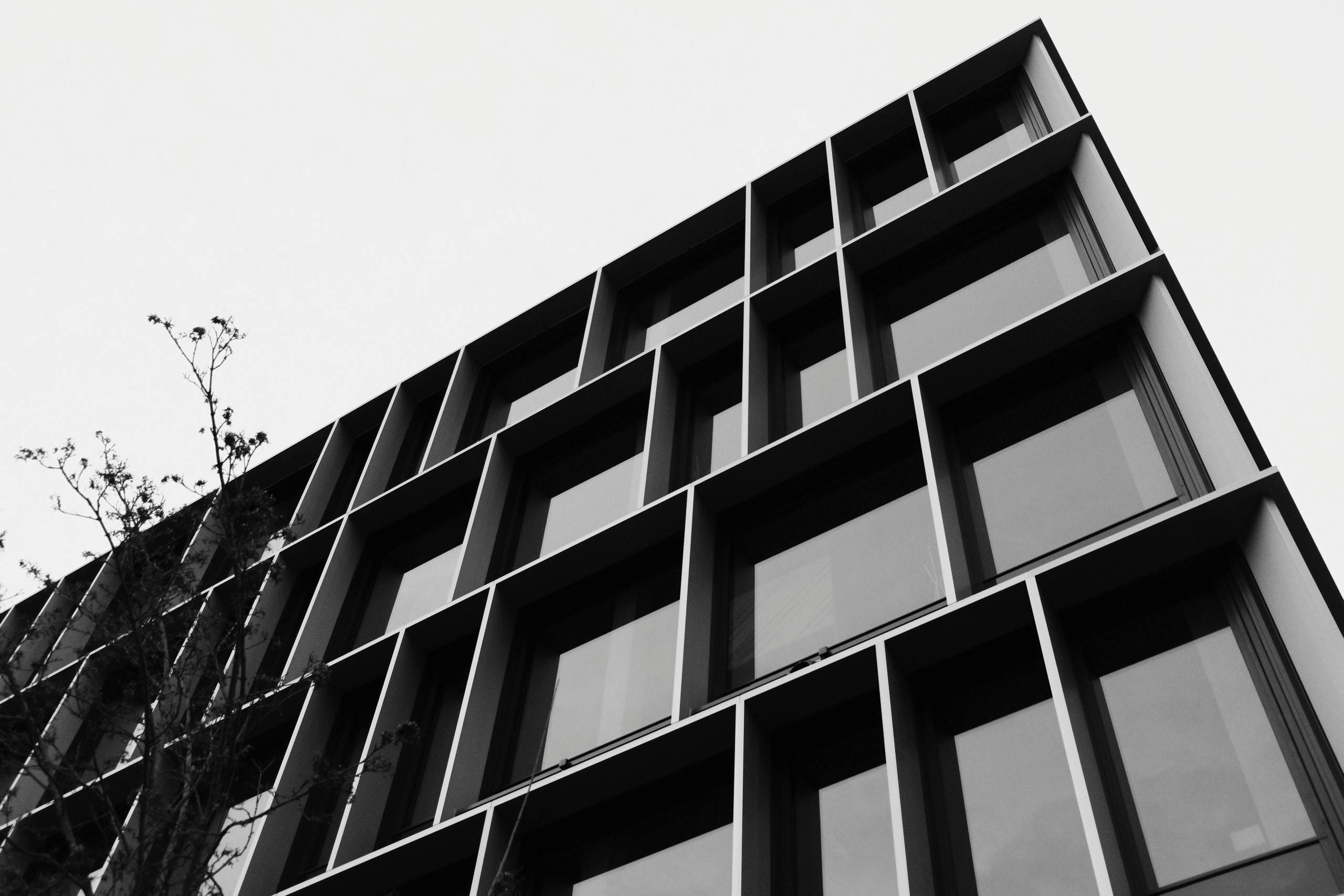 Black and White Photo of Wall of Modern Office Building · Free Stock Photo, image size:1125x750