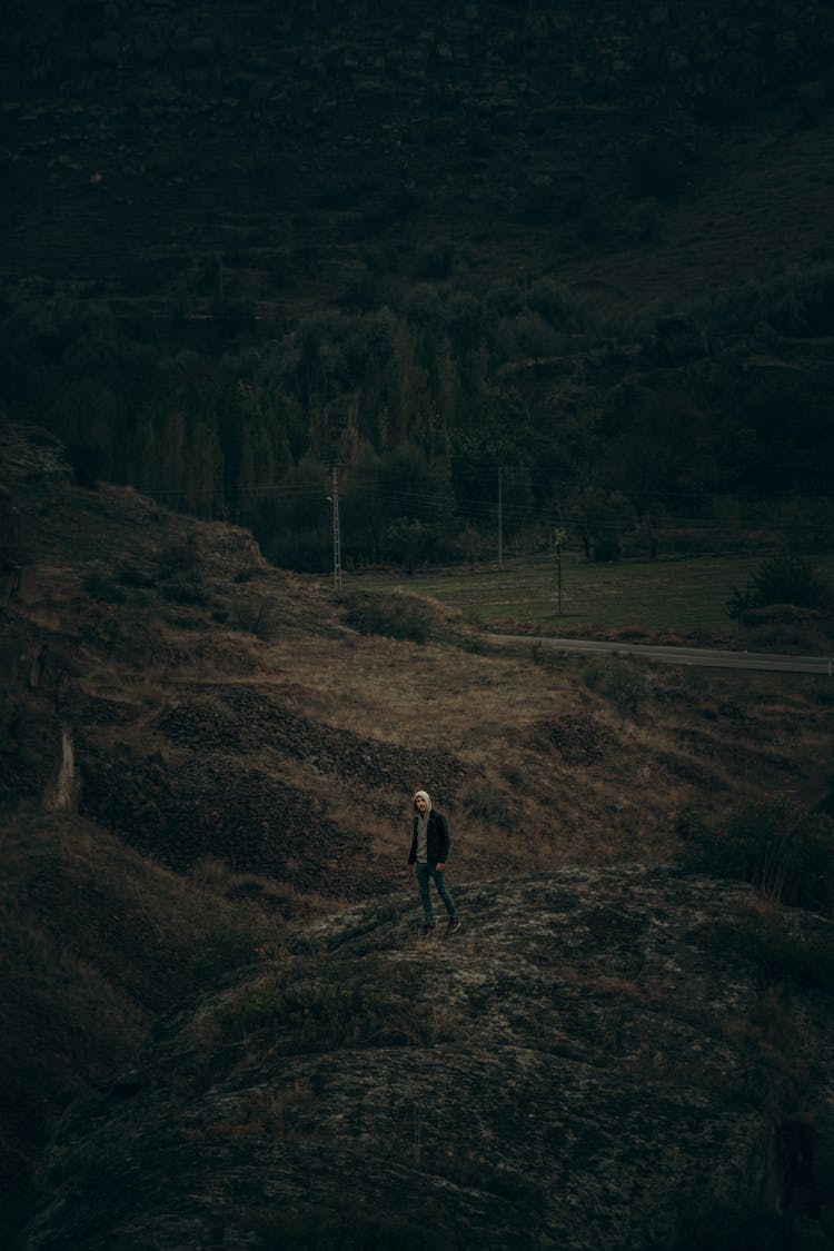 Man On Hill In Countryside