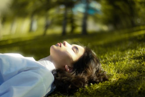 Woman Lying Down with Eyes Closed