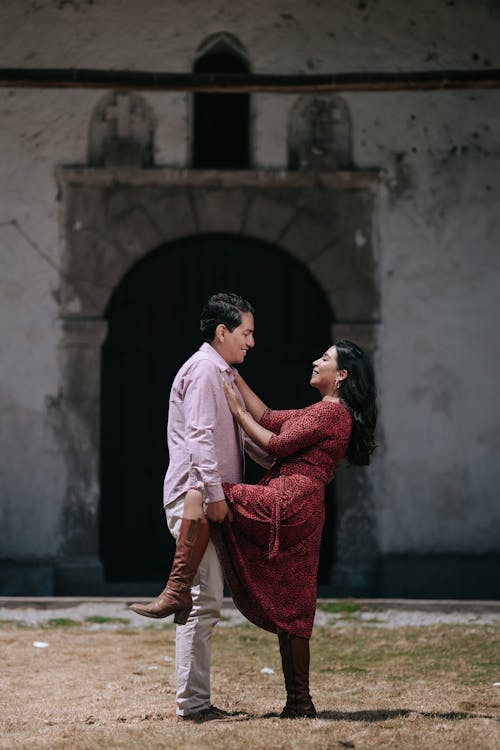 Man and Woman Embracing in a Courtyard