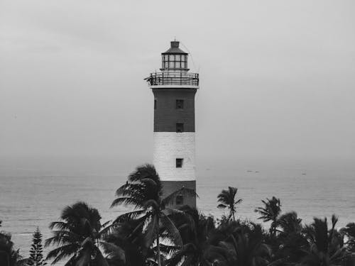 A black and white photo of a lighthouse