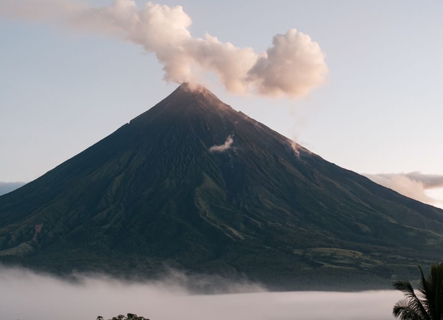 Stunning view of Mayon Volcano emitting smoke in Bicol, Philippines.
