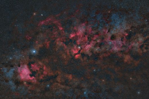 A breathtaking view of a nebula with vibrant colors and distant stars in the cosmos.