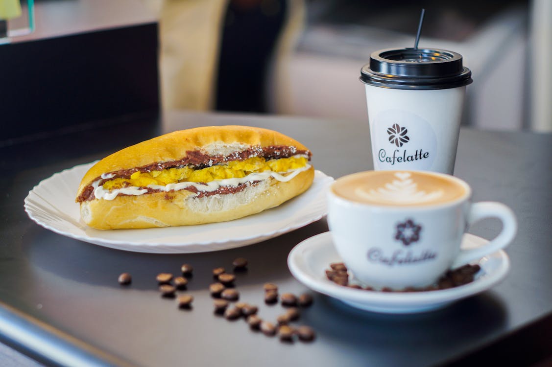 Free Selective Focus Photography of Sandwich Beside Cup Stock Photo