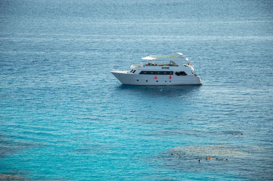 A partner boat with snorkelers near the island