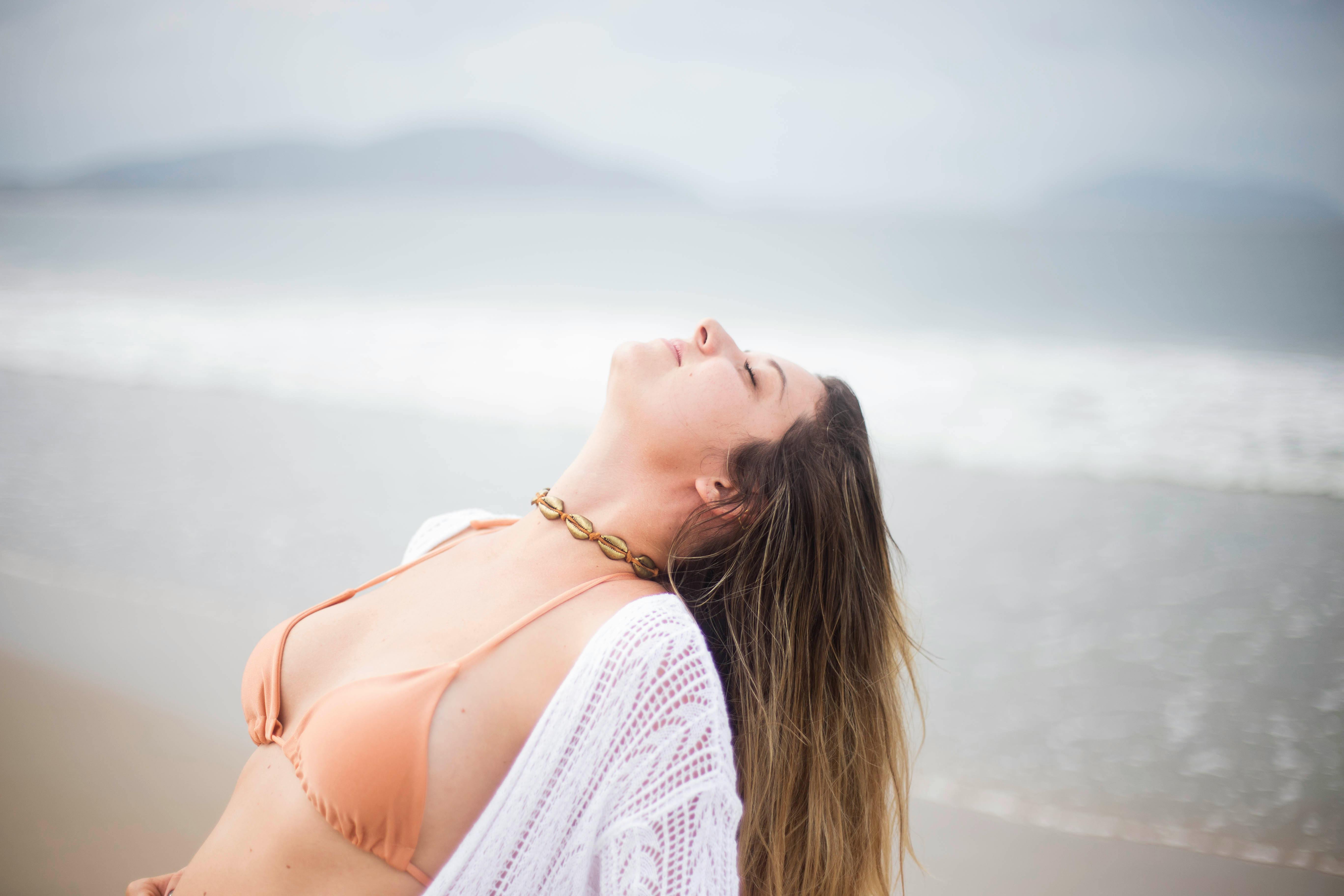 woman standing near ocean