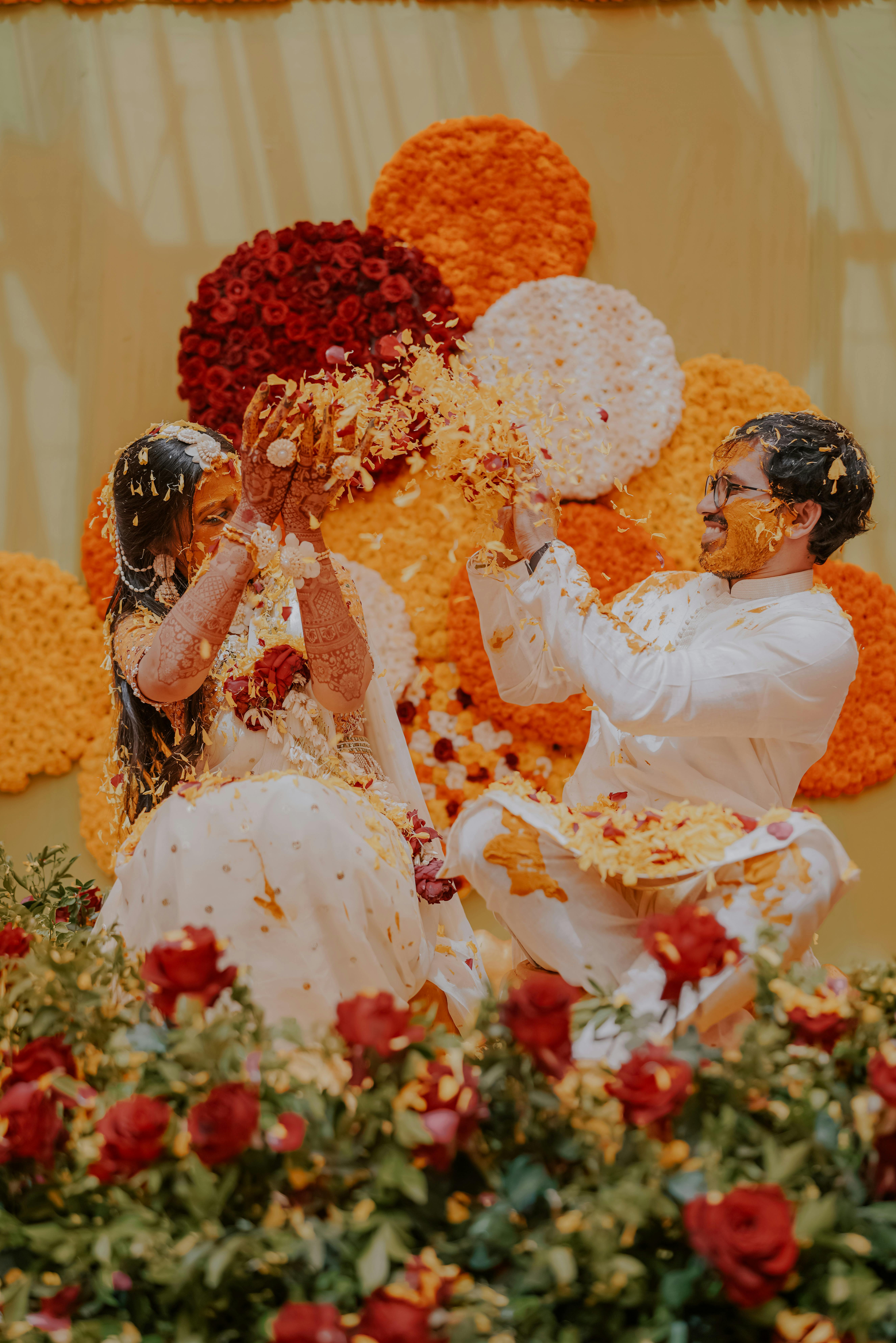Newlywed Couple Throwing Flower Petals · Free Stock Photo