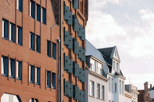 Open Shutters of a Gothic Red Brick Building