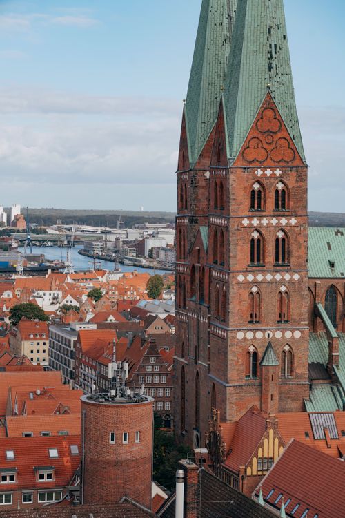 Free Aerial view of Lübeck's skyline dominated by St. Mary's Church, showcasing gothic architecture. Stock Photo