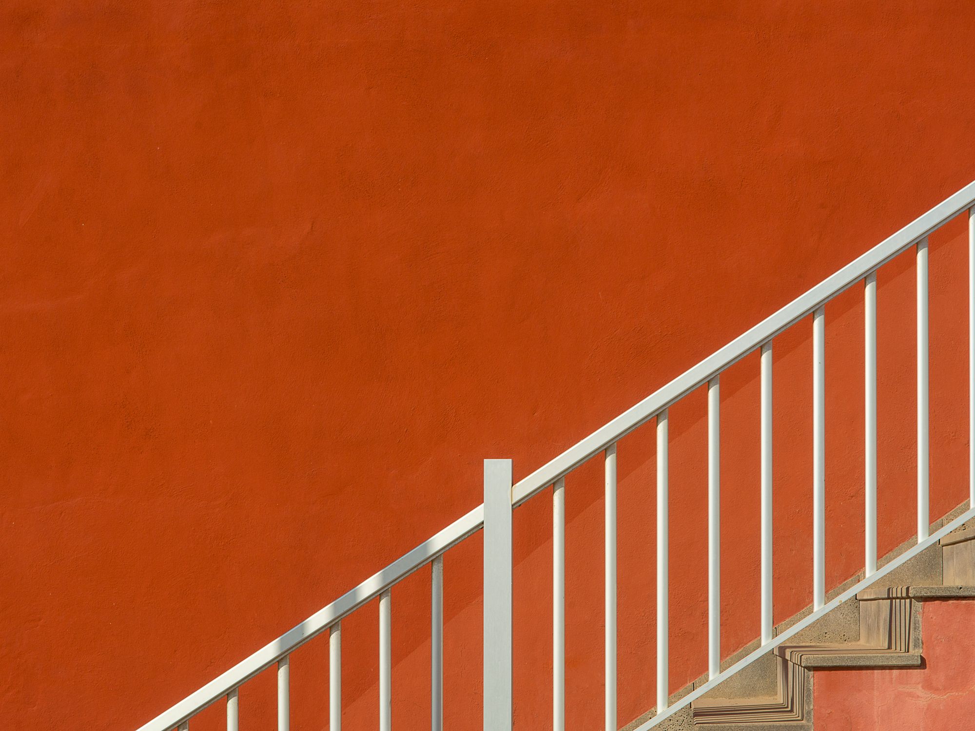 Painters & Decorators in Herne Hill, London — professional decorator painting a wall with a roller