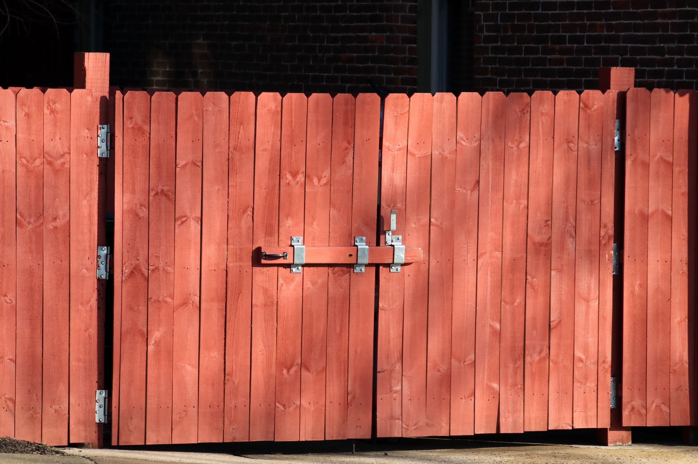 Rustic wooden fence with a metal latch
