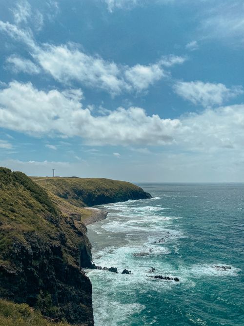 Free Breathtaking coastline in Penghu County, Taiwan, with cliffs meeting the ocean under a vibrant sky. Stock Photo