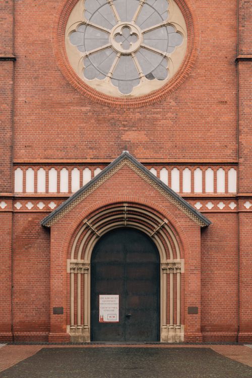 Free Close-up of a Gothic-style church entrance in Hamburg, showcasing intricate architectural details. Stock Photo