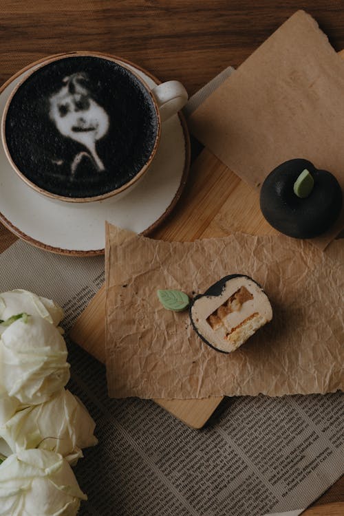 Cup of Black Coffee and a Fruit-Shaped Cakes