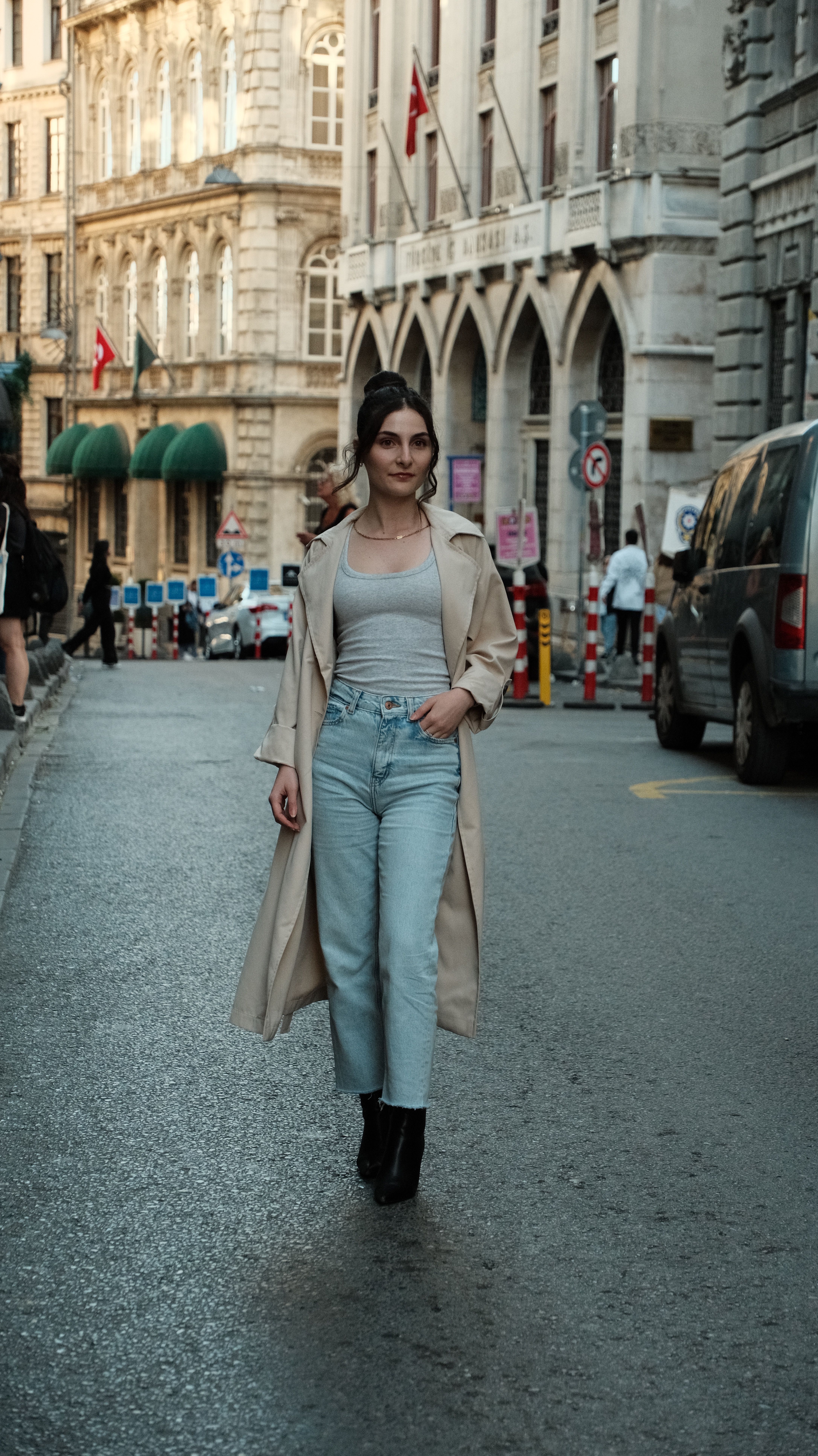 Smiling Woman in Trench Coat on Street · Free Stock Photo
