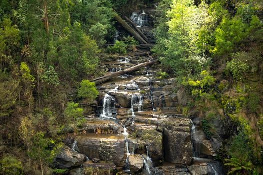 Gorgeous waterfall cascading over rocks in lush Kinglake National Park, Victoria.