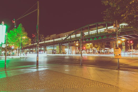 Long exposure captures Berlin's city lights and urban architecture at night.