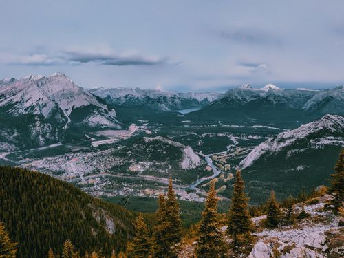 Free Stunning aerial view of Banff, featuring the Rocky Mountains and lush valleys. Stock Photo