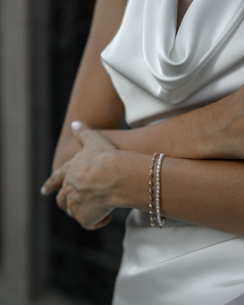 Close up of Woman with Arms Crossed and Bracelets