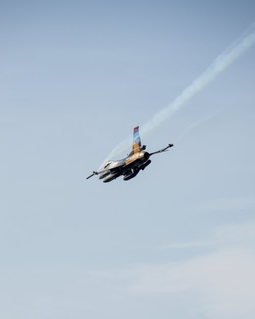 Military Fighter on Clear Sky