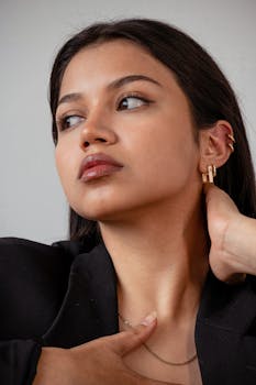 Close-up portrait of a woman showcasing elegance and style with jewelry.