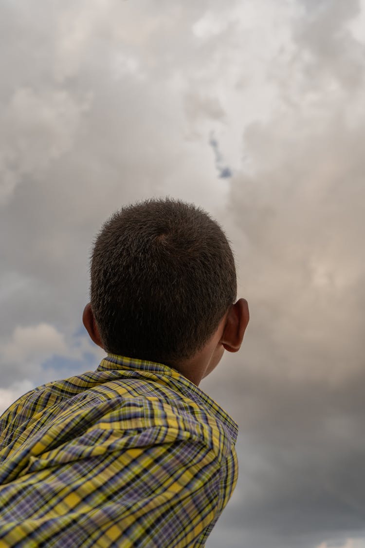 A Boy Looking At The Sky 