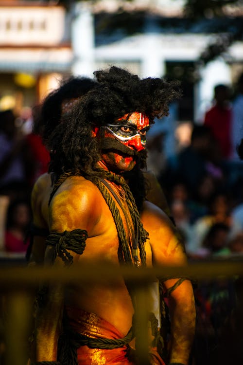 Men with Face and Body Paintings at a Parade 