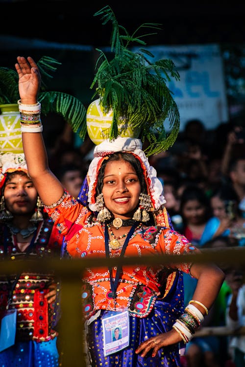 Women Dancing in Traditional Clothing at a Parade
