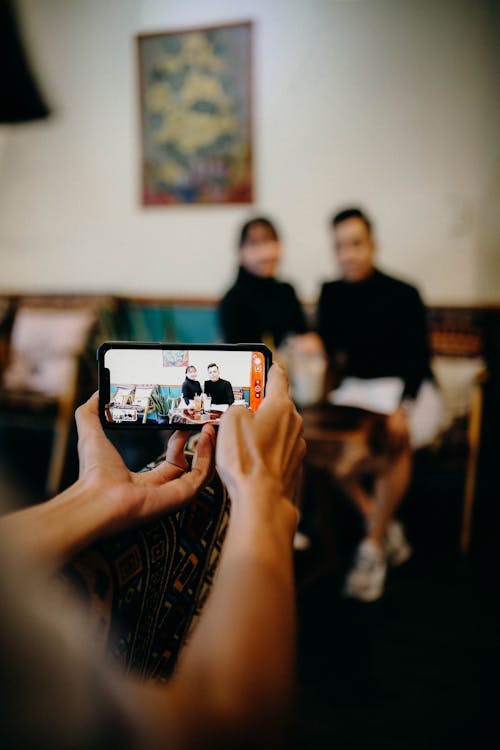 Couple Posing in front on Smartphone