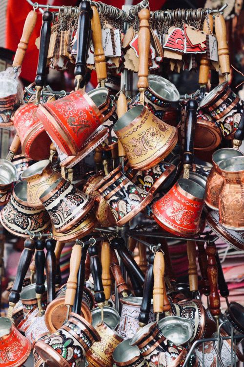 Free Ornate Turkish coffee pots in a vibrant market stall. Ideal for travel and culture projects. Stock Photo