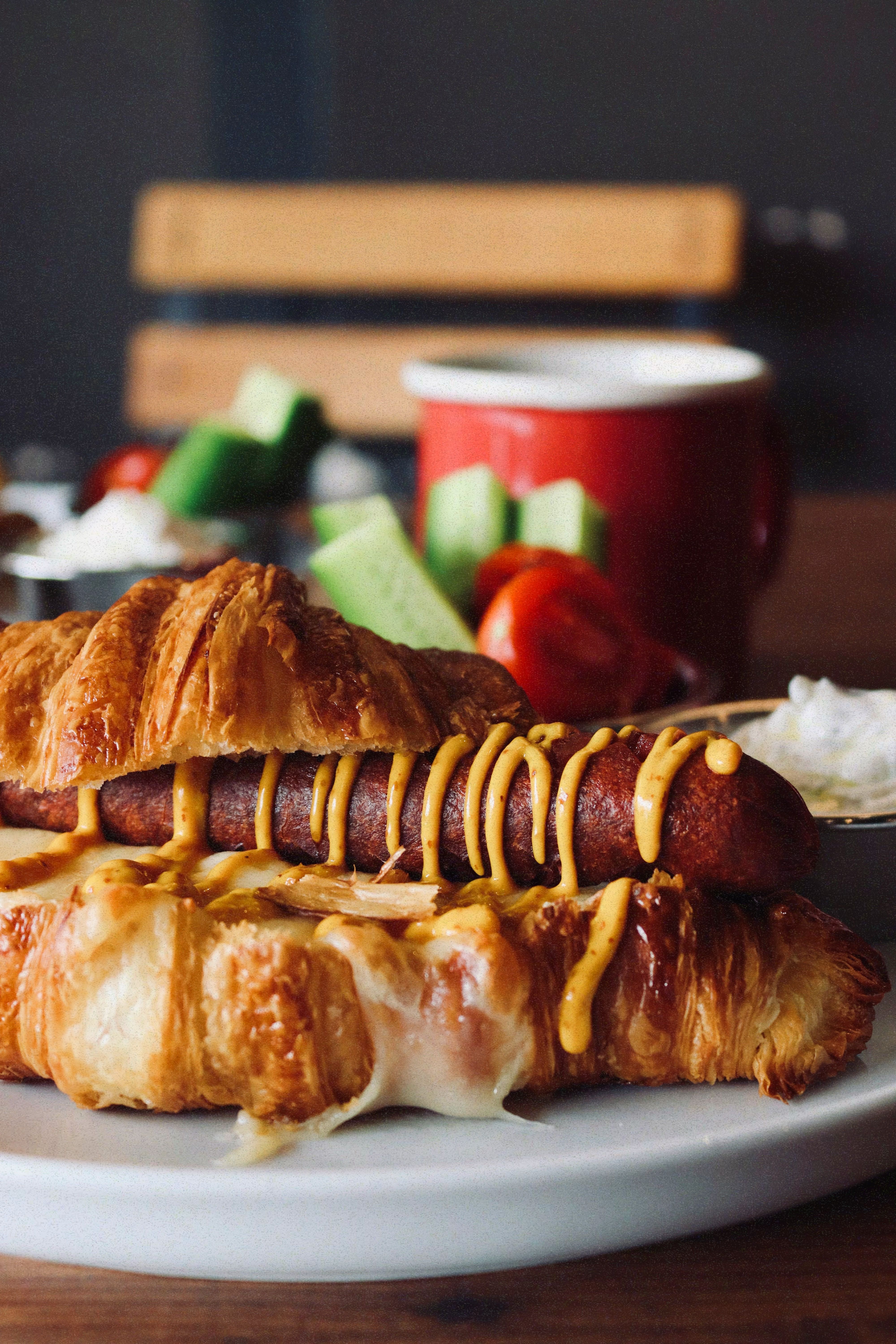 Golden sausage pastry served with mustard