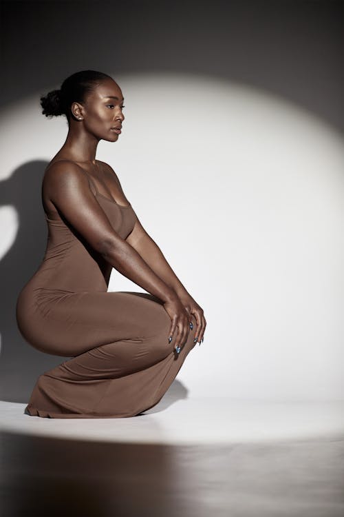 Beautiful Woman Posing in a Brown Maxi Dress