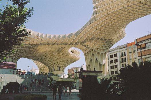 Experience the stunning architectural design of Metropol Parasol in Seville, Spain, captured during a sunny day.