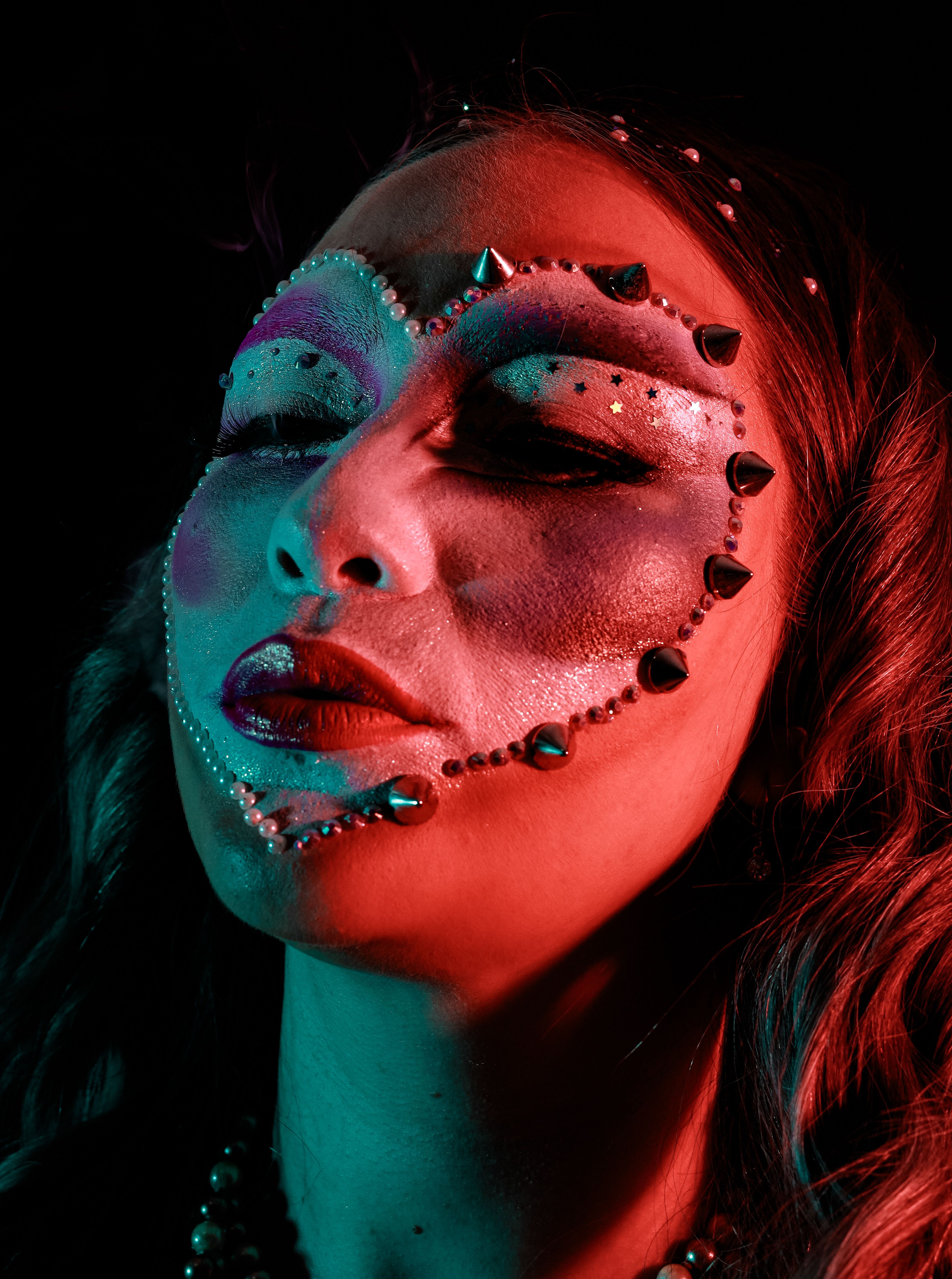 Close-Up Shot of Woman with Yellow and Orange Face Paint · Free Stock Photo