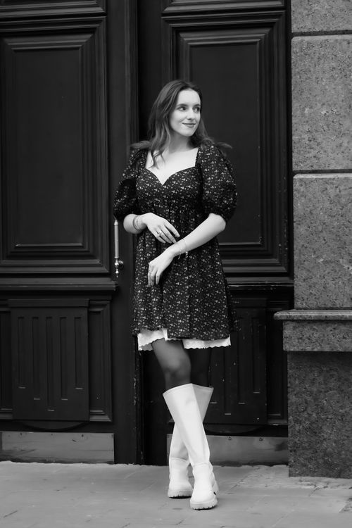 Woman Posing in Black Floral Print Mini Dress and Beige Leather Boots Free Stock Photo Woman Posing in Black Floral Print Mini Dress and Beige Leather Boots Free Stock Photo